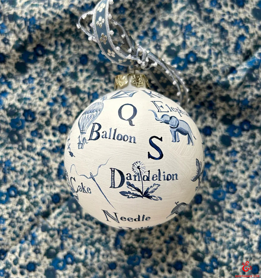 Hand-painted blue and white letter decoration