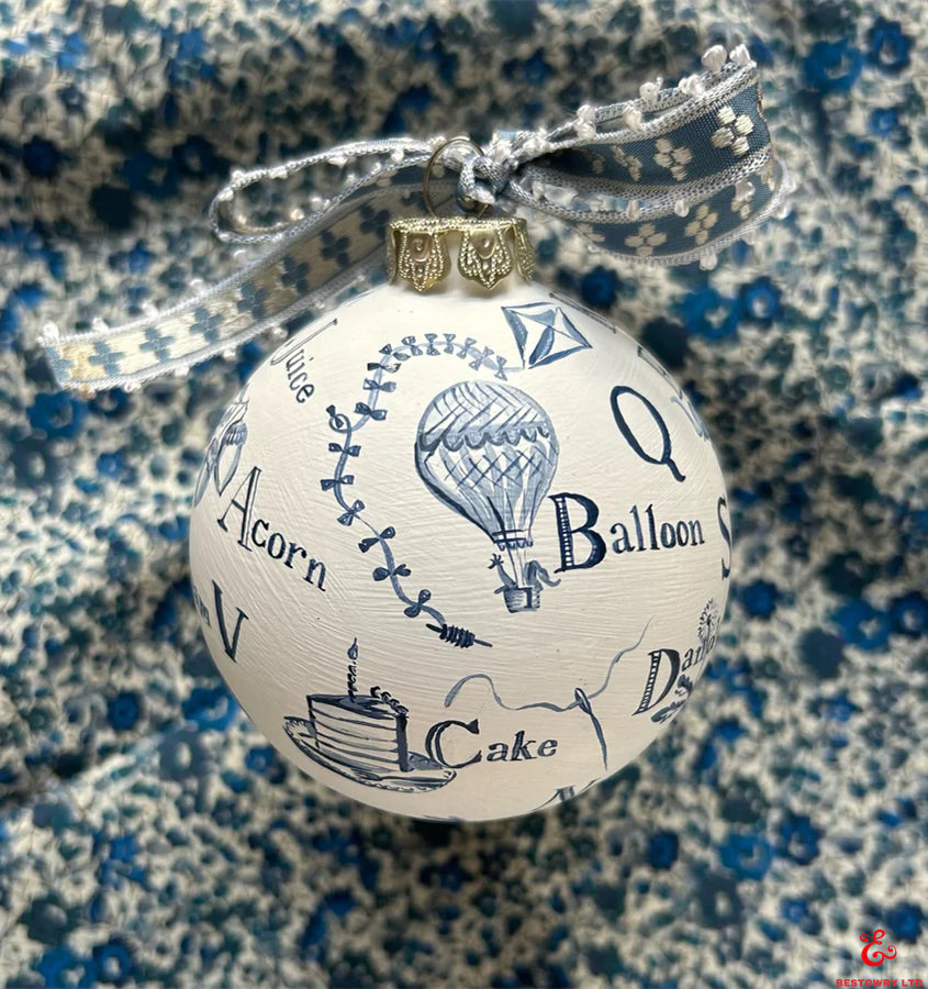 Hand-painted blue and white letter decoration